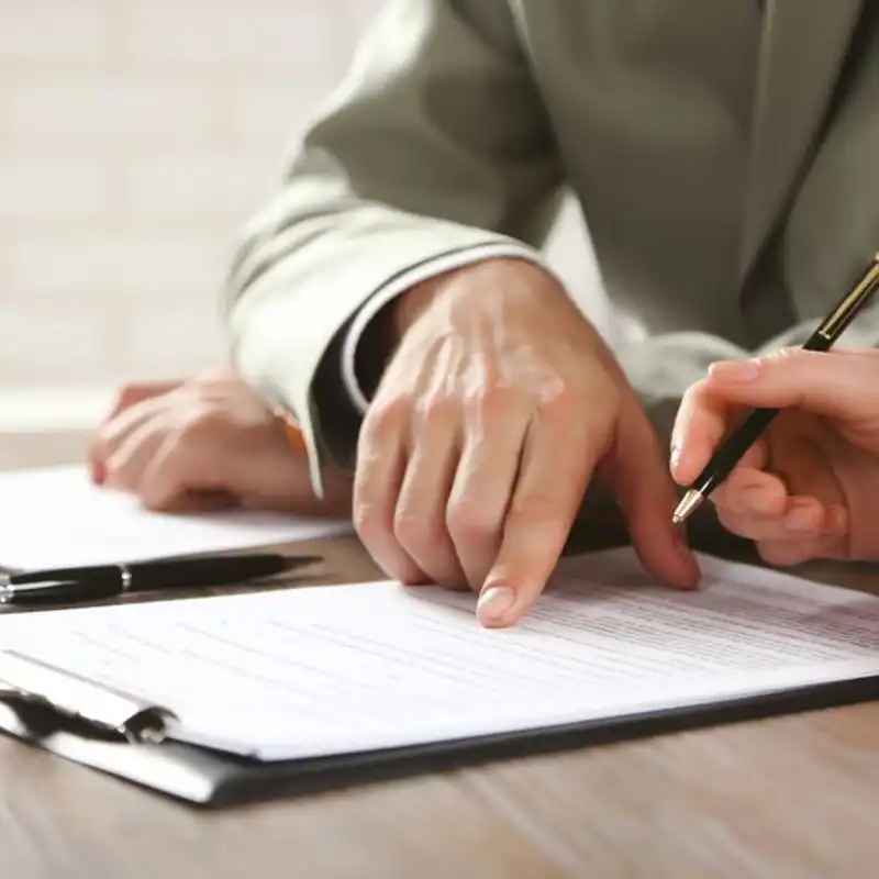 Human hands working with documents at the desk closeup.