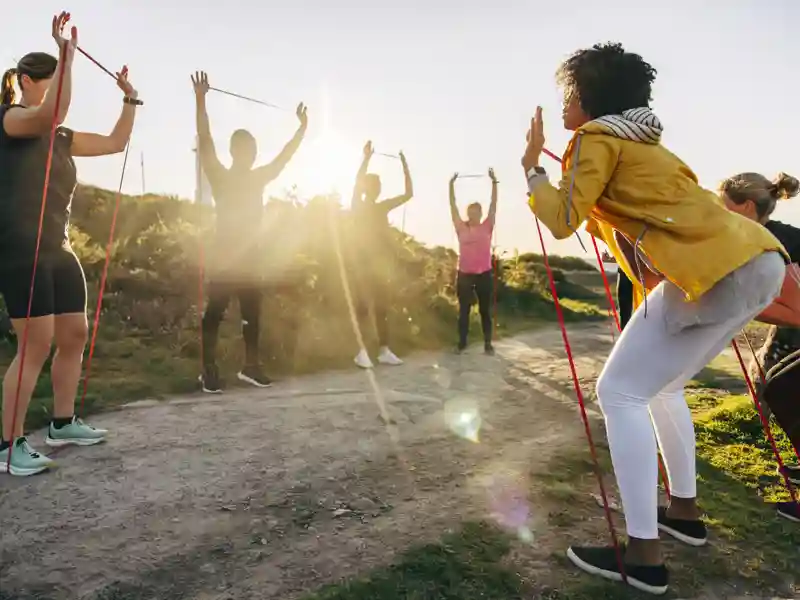 People using resistance bands during training.