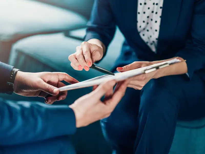 Businesspeople using a tablet.