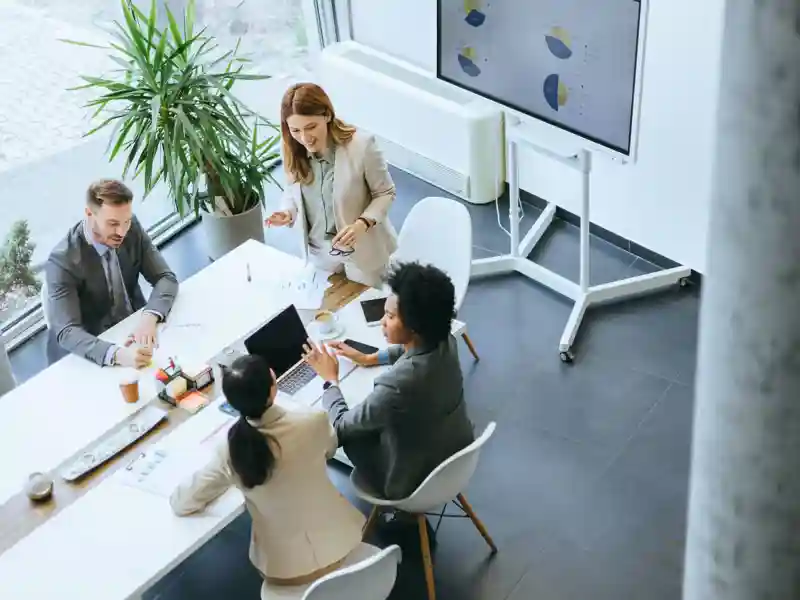 Overhead view of an office business discussion in a modern office.